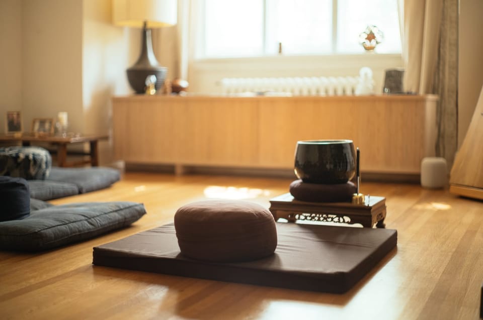 meditation cushion in front a mindfulness bell